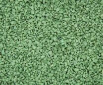 Close-up of small, irregular green rubber granules or chips, with a slightly rough texture, spread evenly across the entire image.