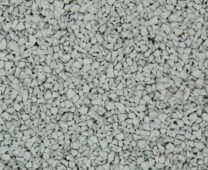 A close-up view of a surface covered in small, irregularly shaped light gray gravel or crushed stones, densely packed and evenly spread.