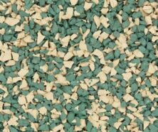 Close-up of a surface covered with small, irregularly shaped rubber granules colored green and beige, often used for playground flooring or athletic tracks.