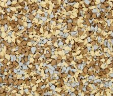 A close-up of small, irregularly shaped granules in tan, light yellow, and light gray colors, densely packed together and covering the entire frame.